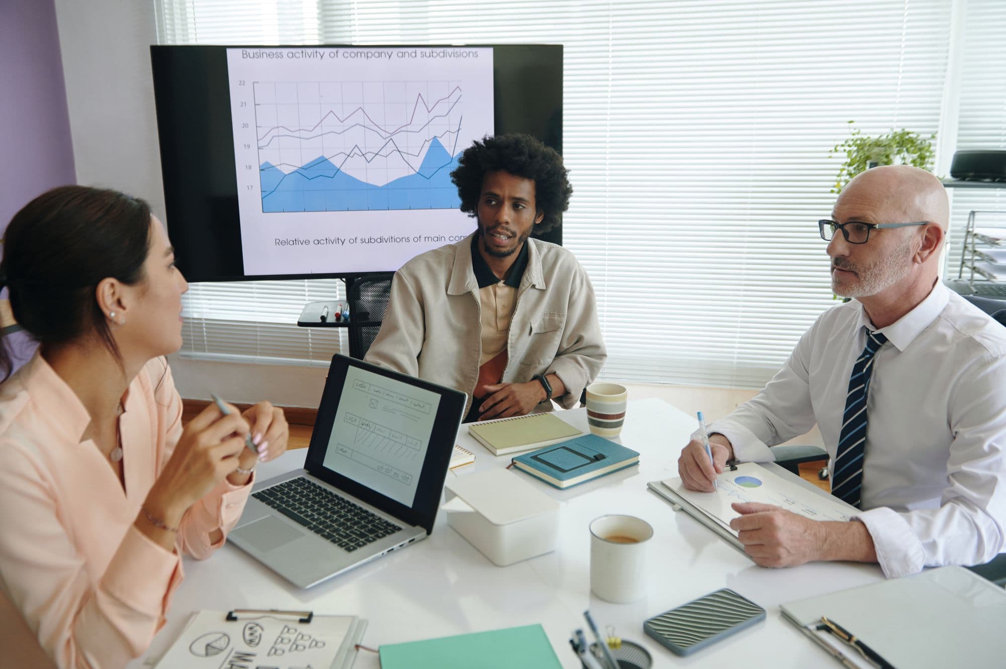 A team of marketers discussing content strategy together