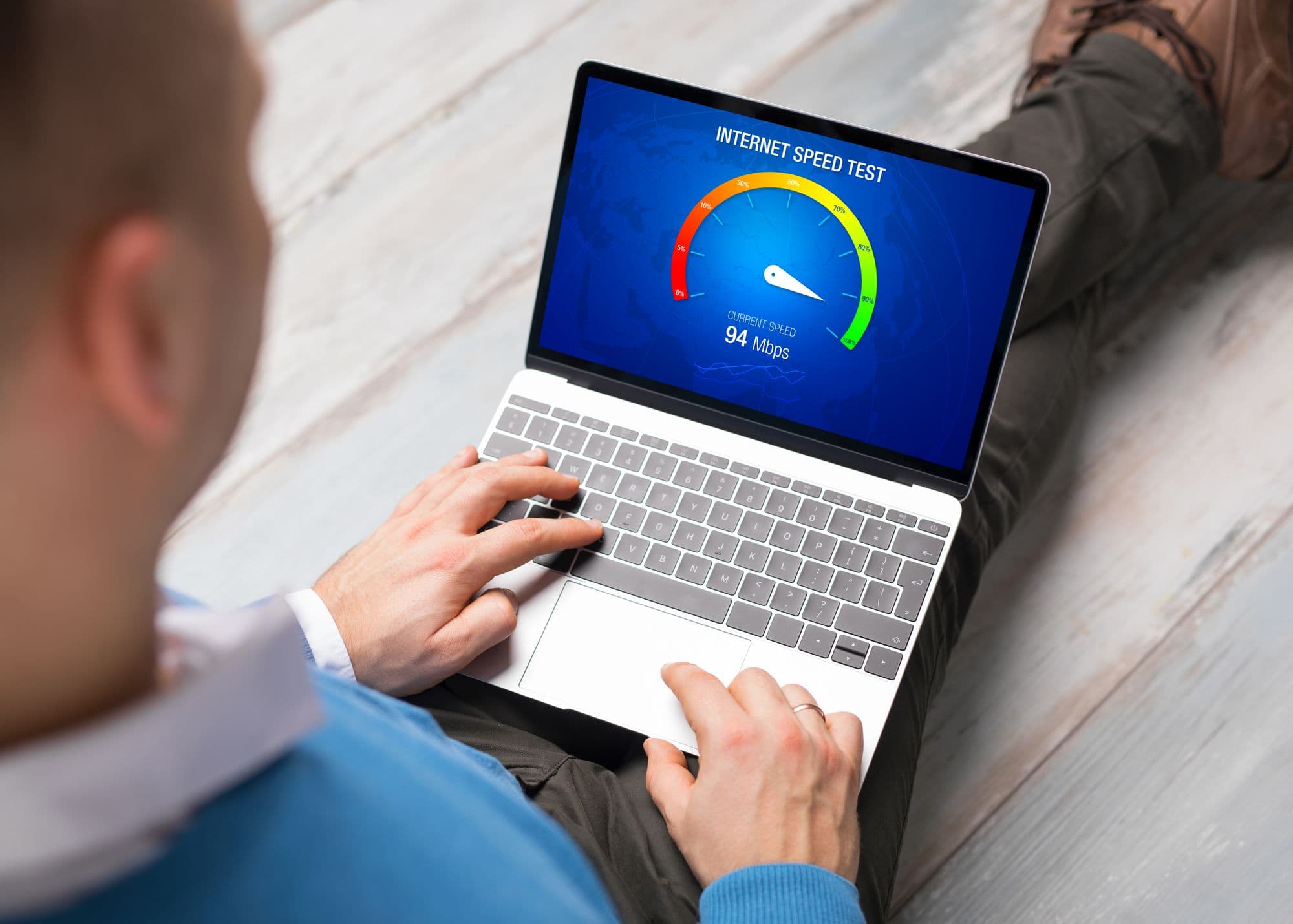 A person checking website loading speed on a laptop